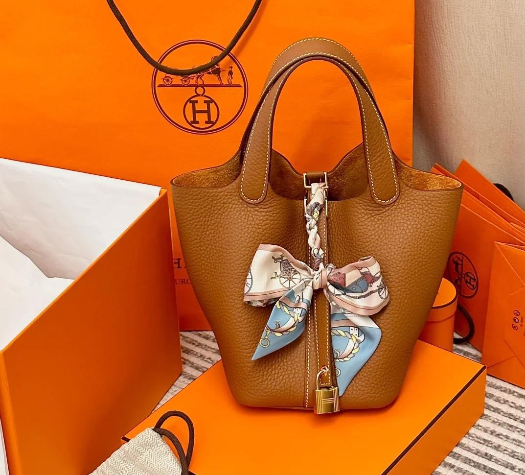 Hermès Picotin leather bag, known for its minimalist design and signature charm.