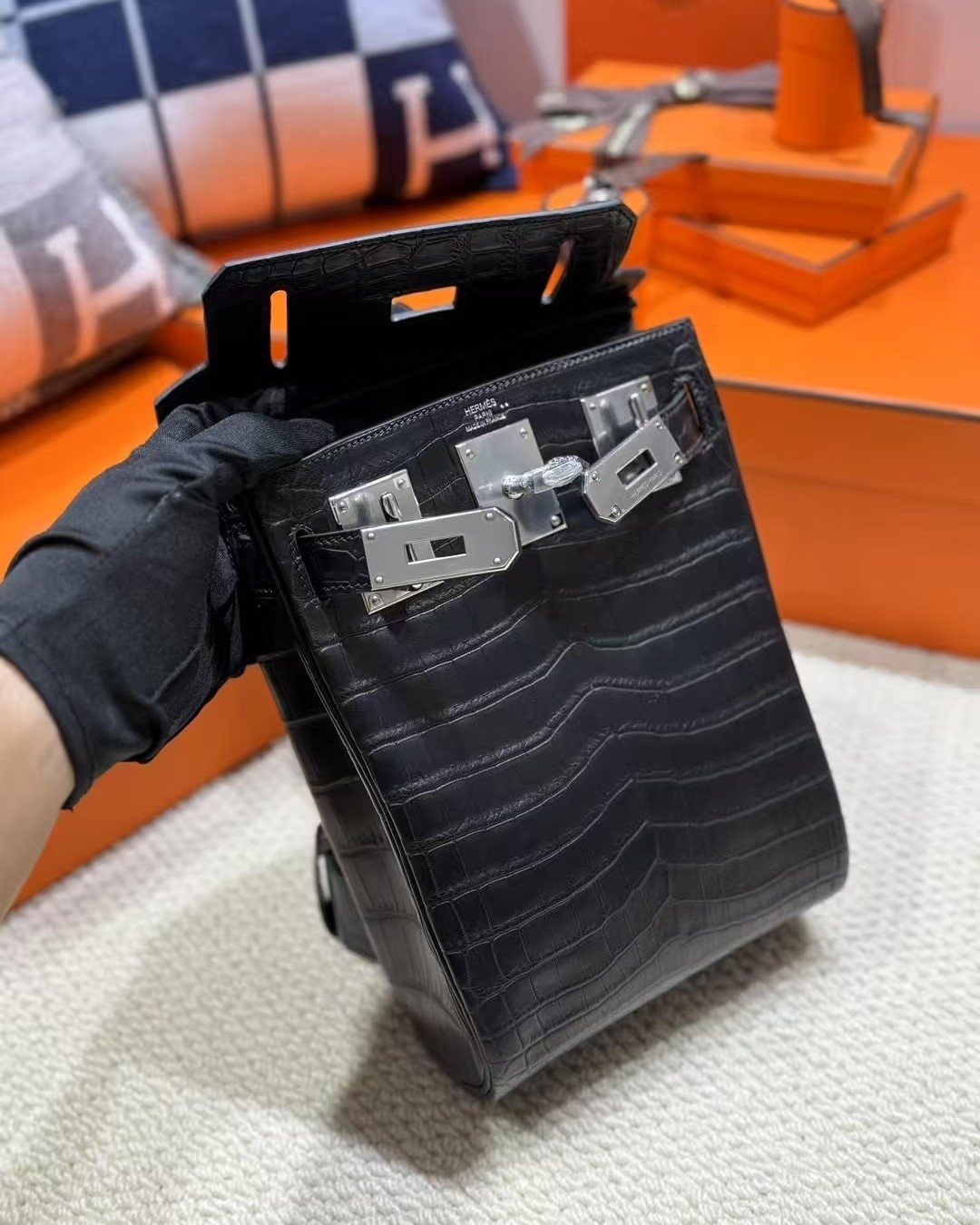 Close-up of a custom HAC a Dos PM in Matte Black Niloticus Crocodile leather